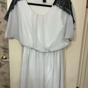 Elegant White Dress with Black Lace Accents